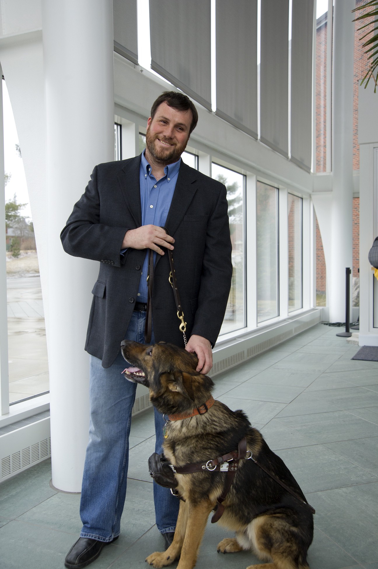 Picture of Nicholas Giudice with his guide dog.  