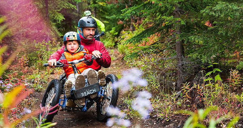 Christian Bagg rides his Bowhead Reach e-bike through the forest.