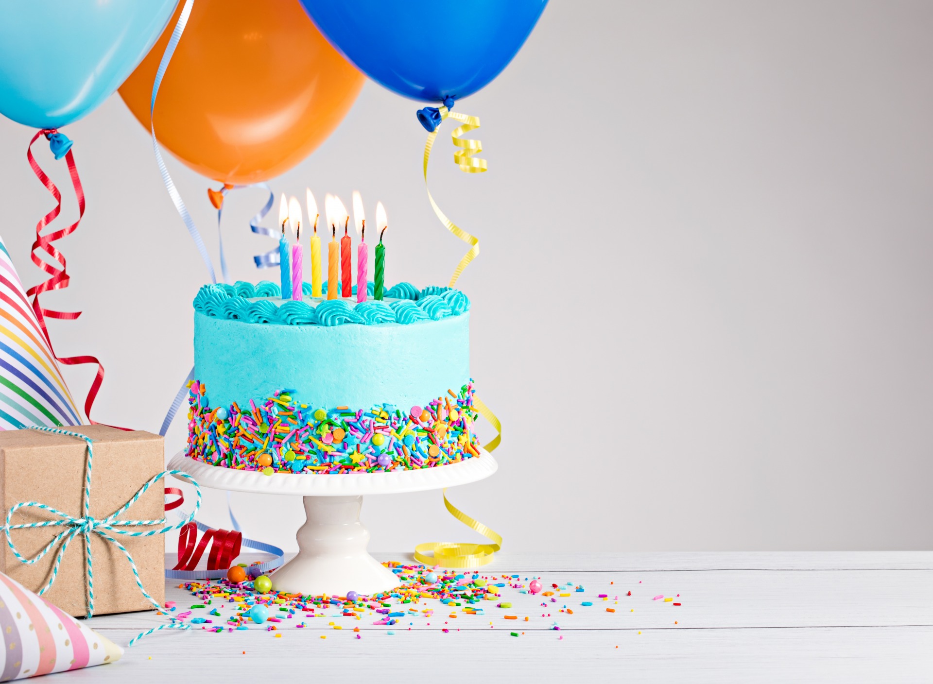 A birthday cake and balloons 