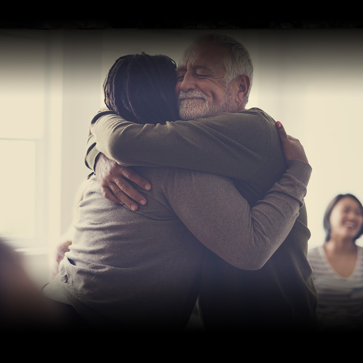 A man and woman hug