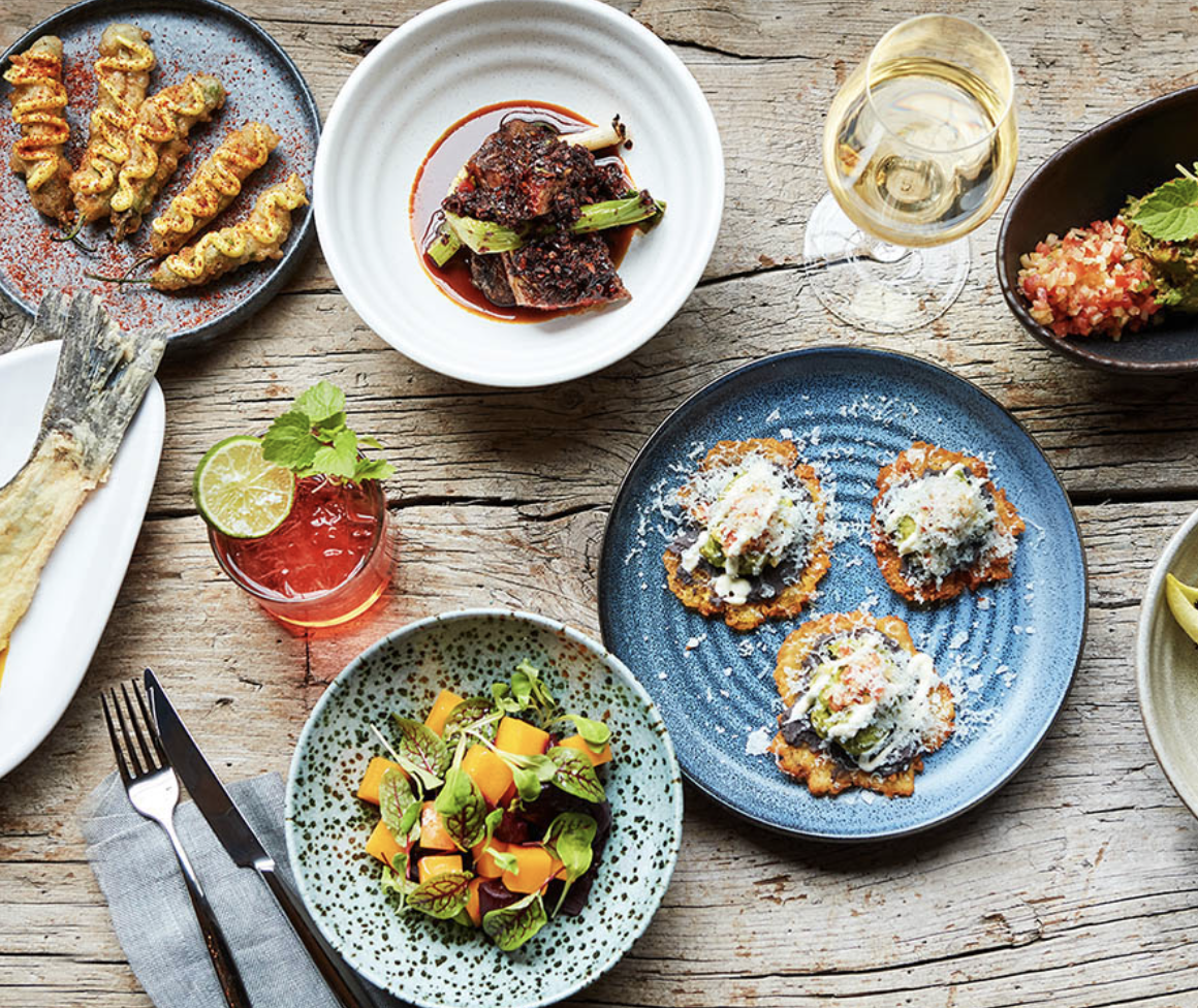 Various foods and dishes on a table