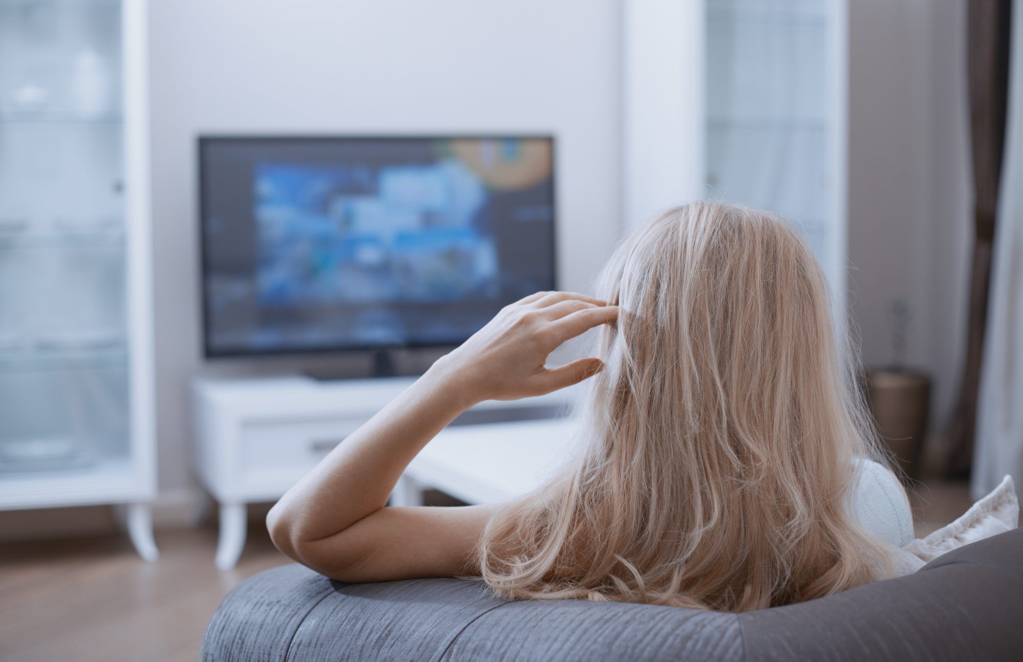 A woman watching TV