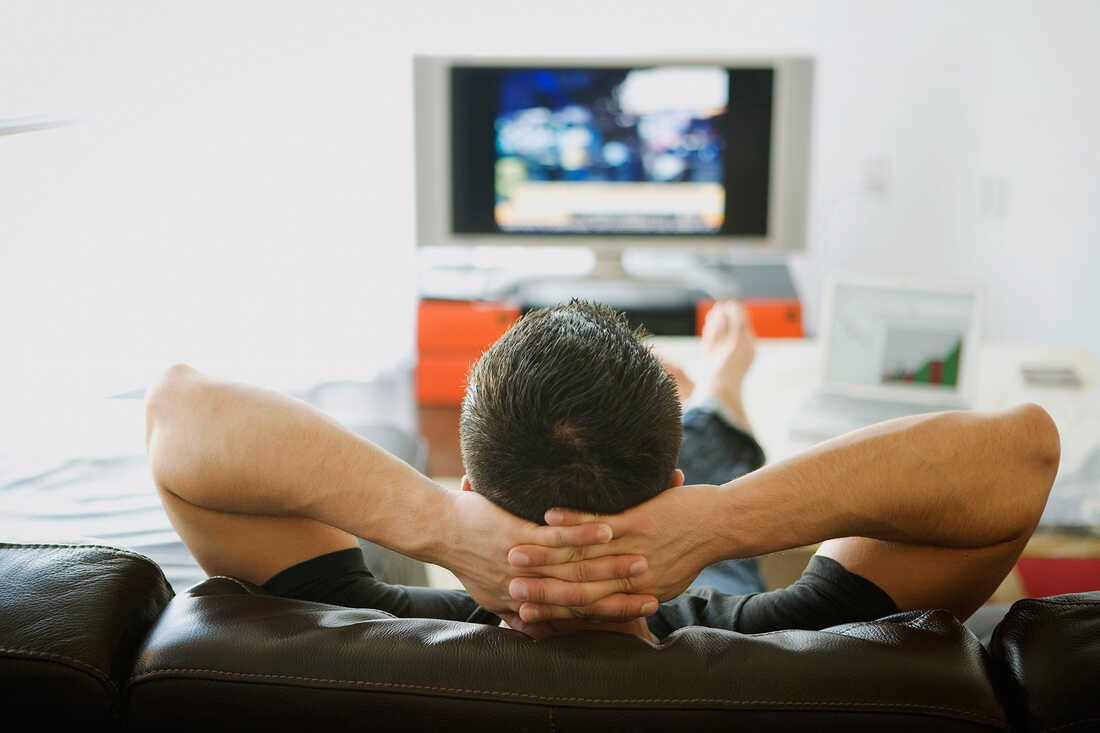 A man watching TV