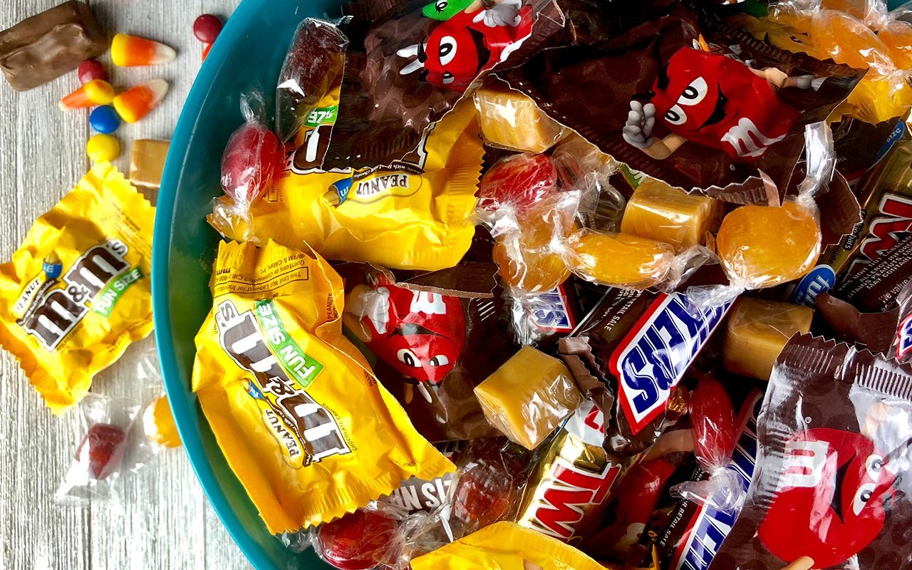 Various Halloween candy in a bowl