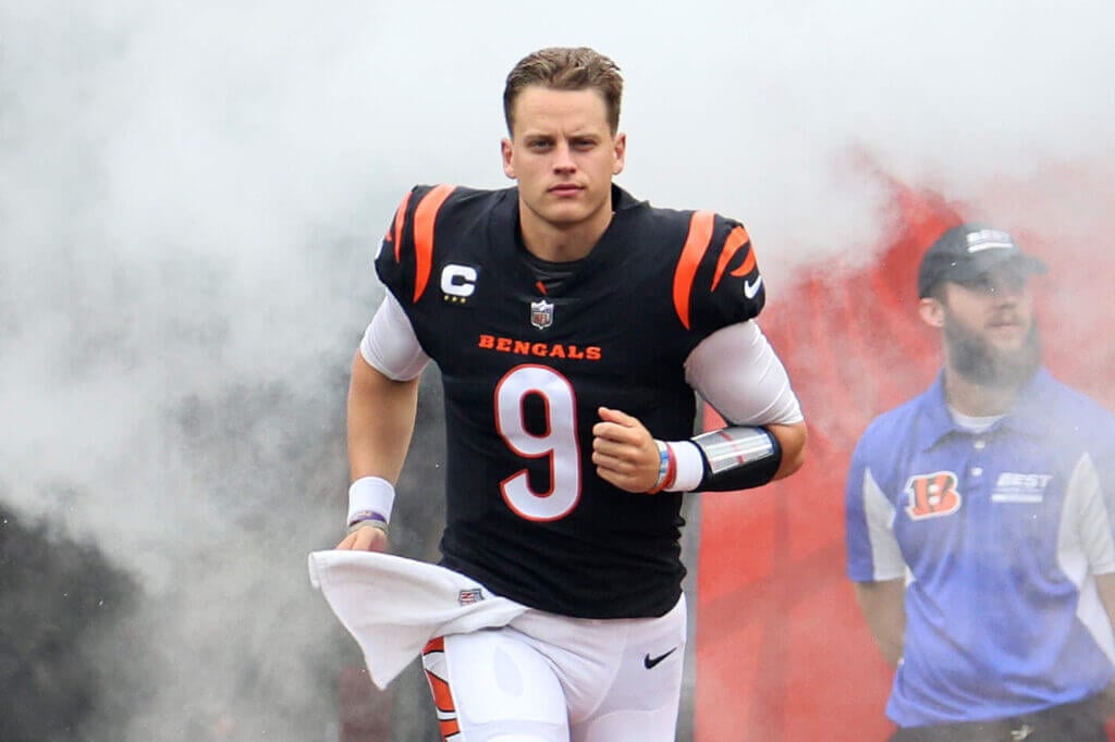 Cincinnati Bengals Quarterback Joe Burrow running on the football field 