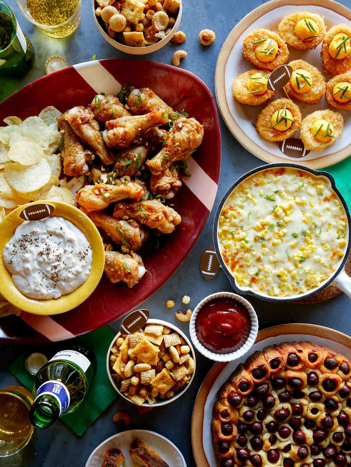 A bunch of finger food lined up on a table