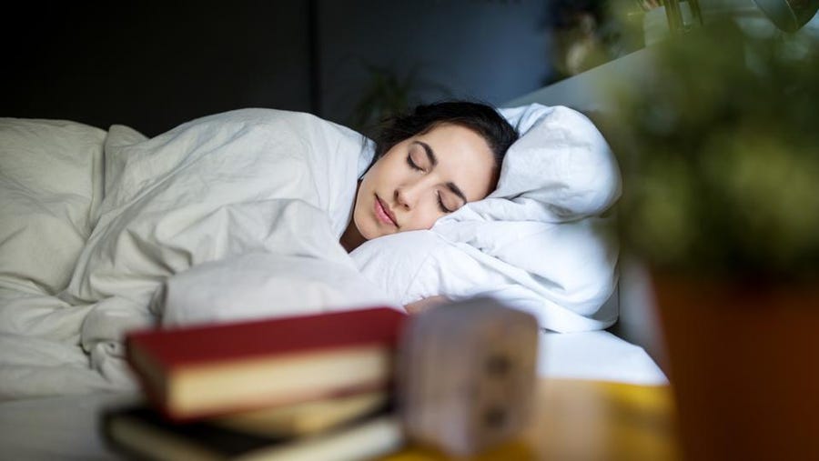 A woman sleeping in a bed