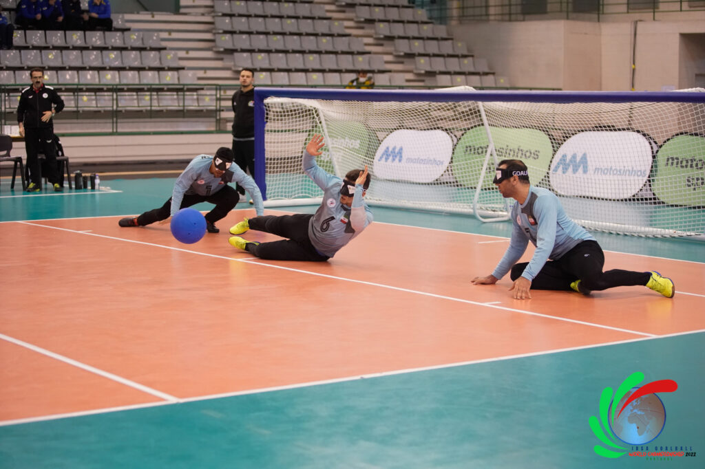 3 people playing goalball