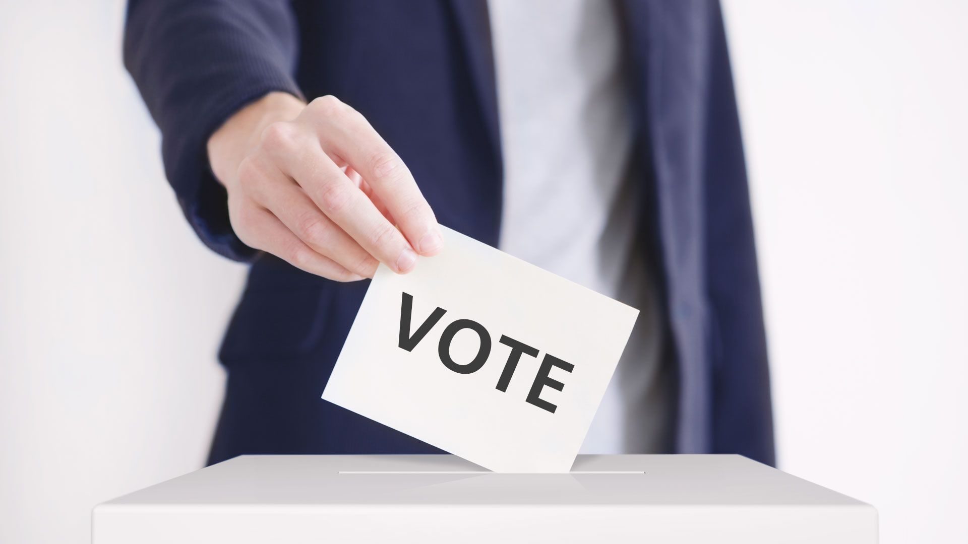 A person casting a ballot