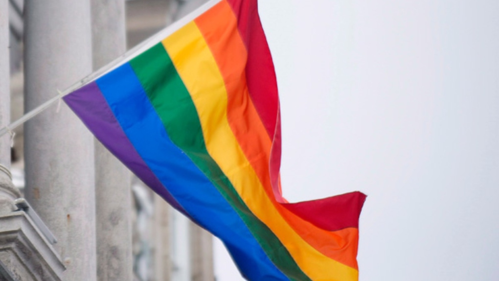 A pride flag on a building