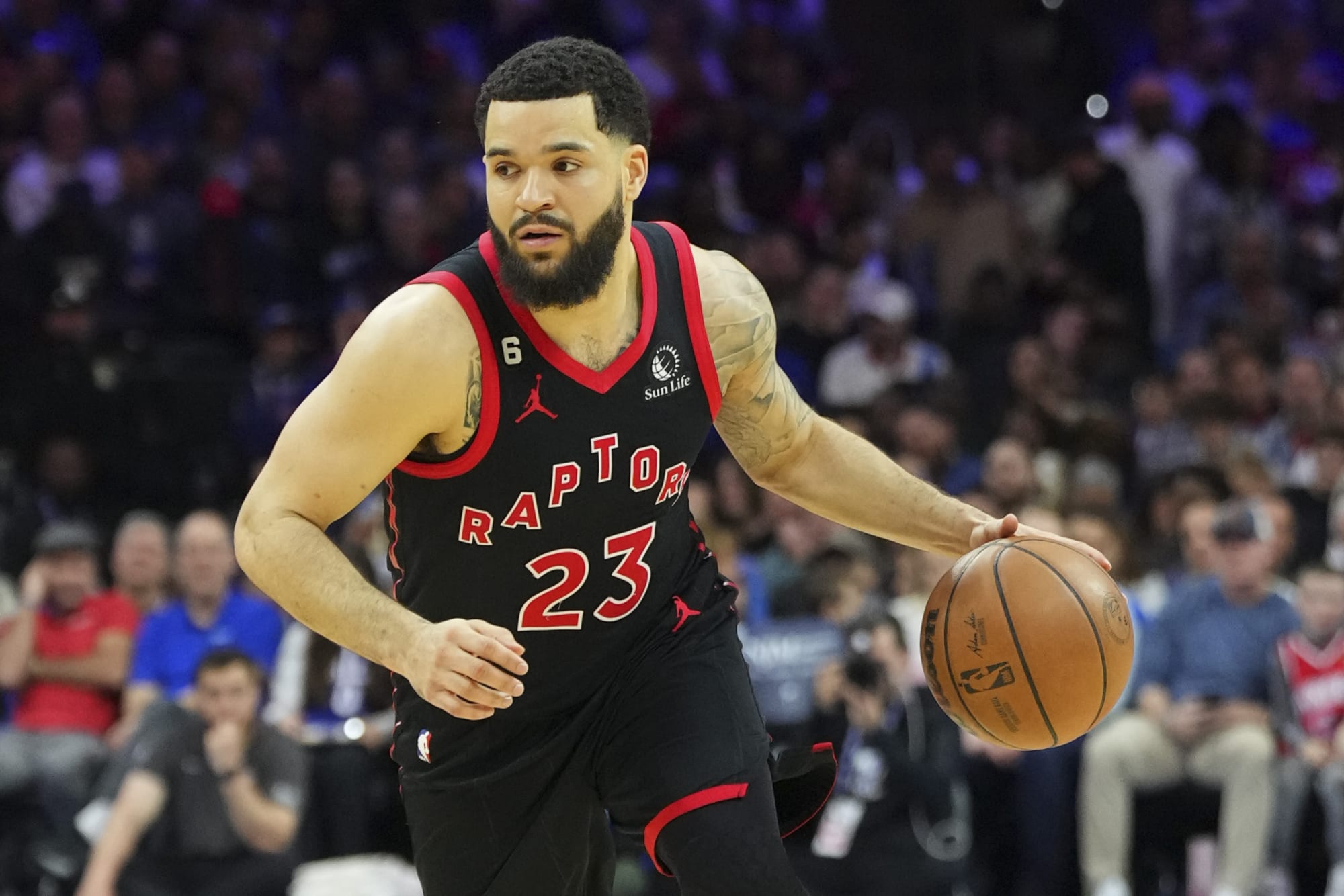 Fred VanVleet dribbling a basketball mid game